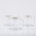Transparent plastic drinking cup with spill-proof design on a plain background.
