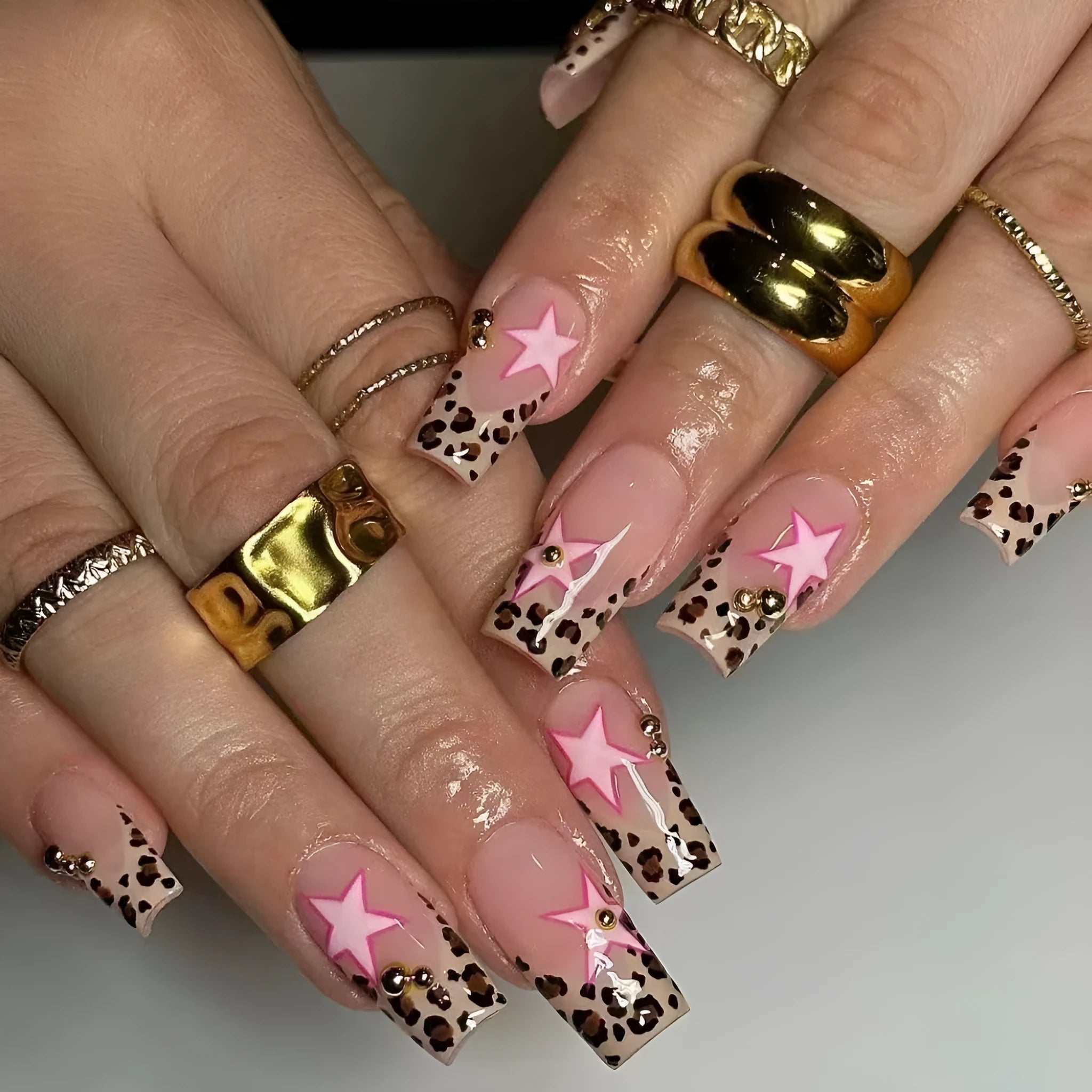 French manicure press on nails with leopard print pattern, star and pearl diamond accents