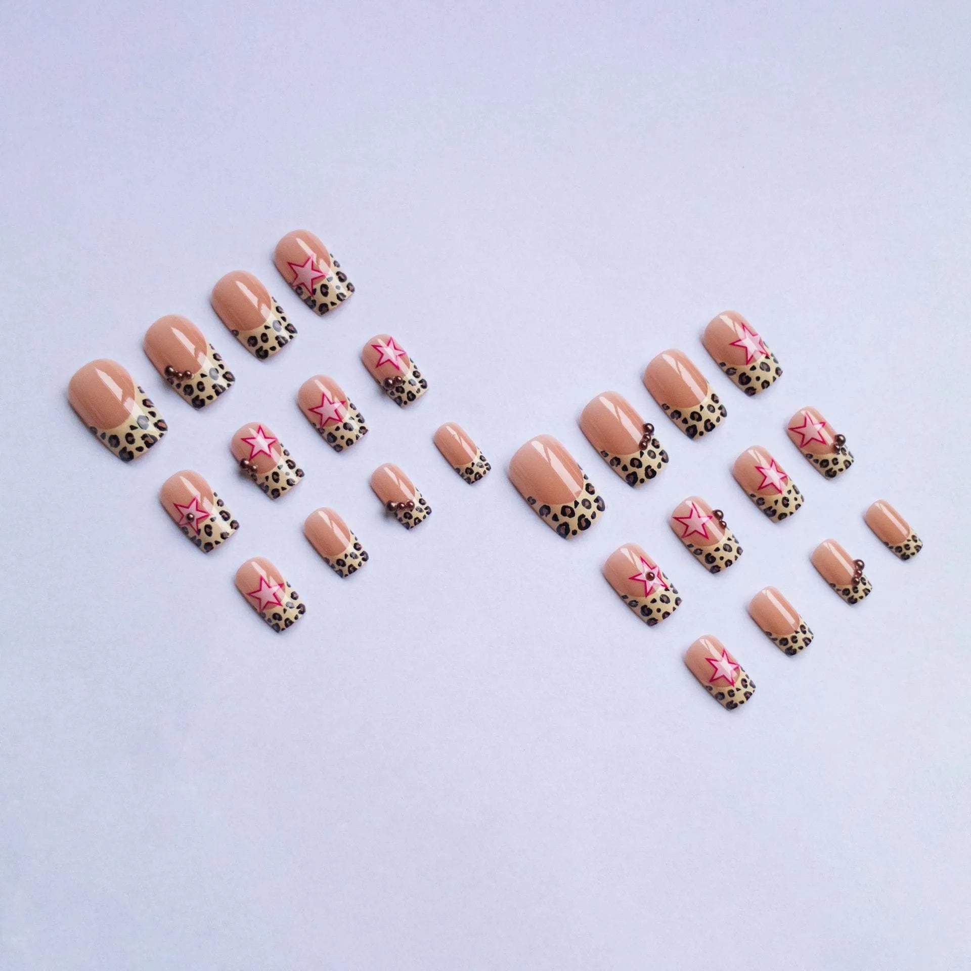French manicure press on nails with leopard print pattern, star and pearl diamond accents
