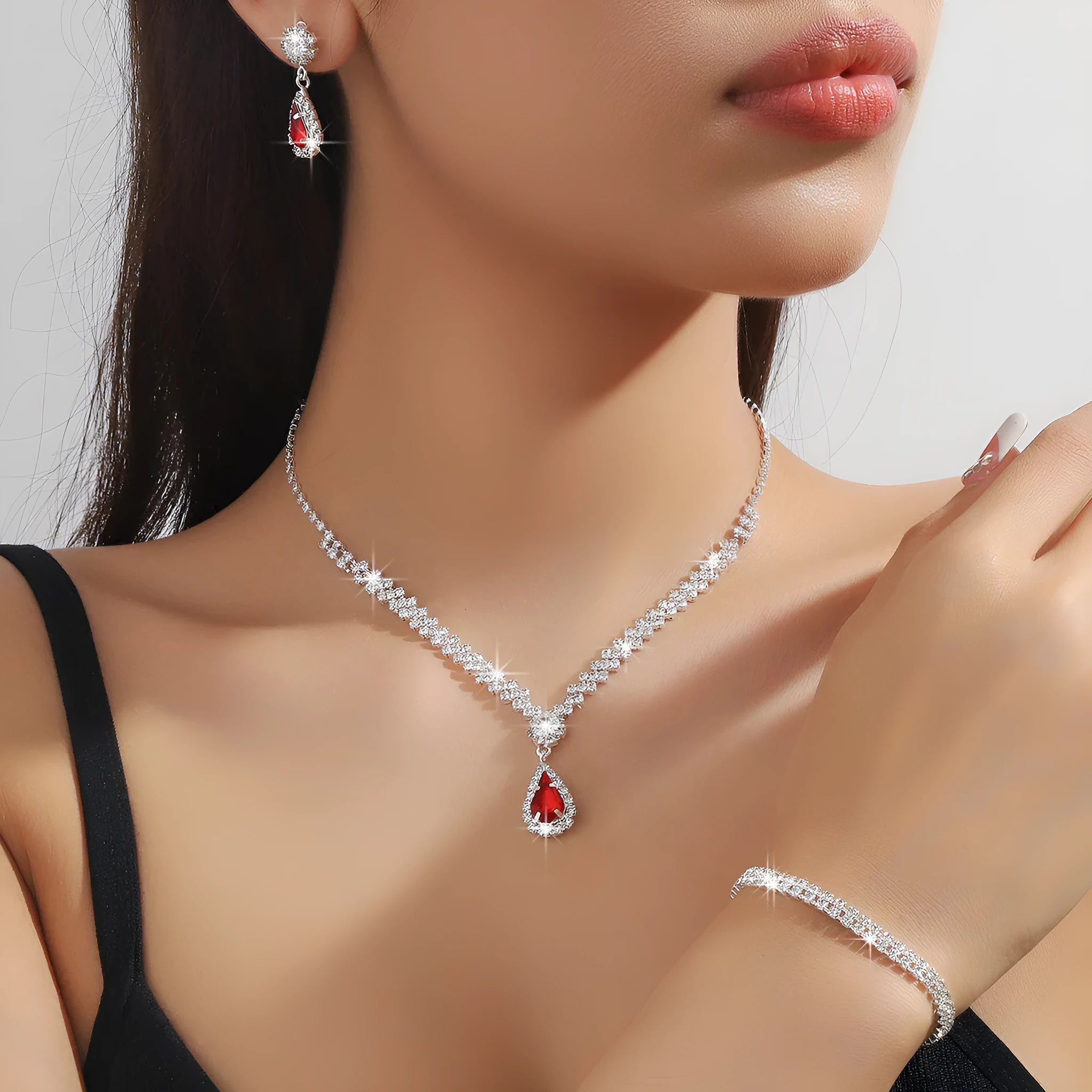 Claw chain necklace and earrings set with rhinestone drop elements in multiple colour options