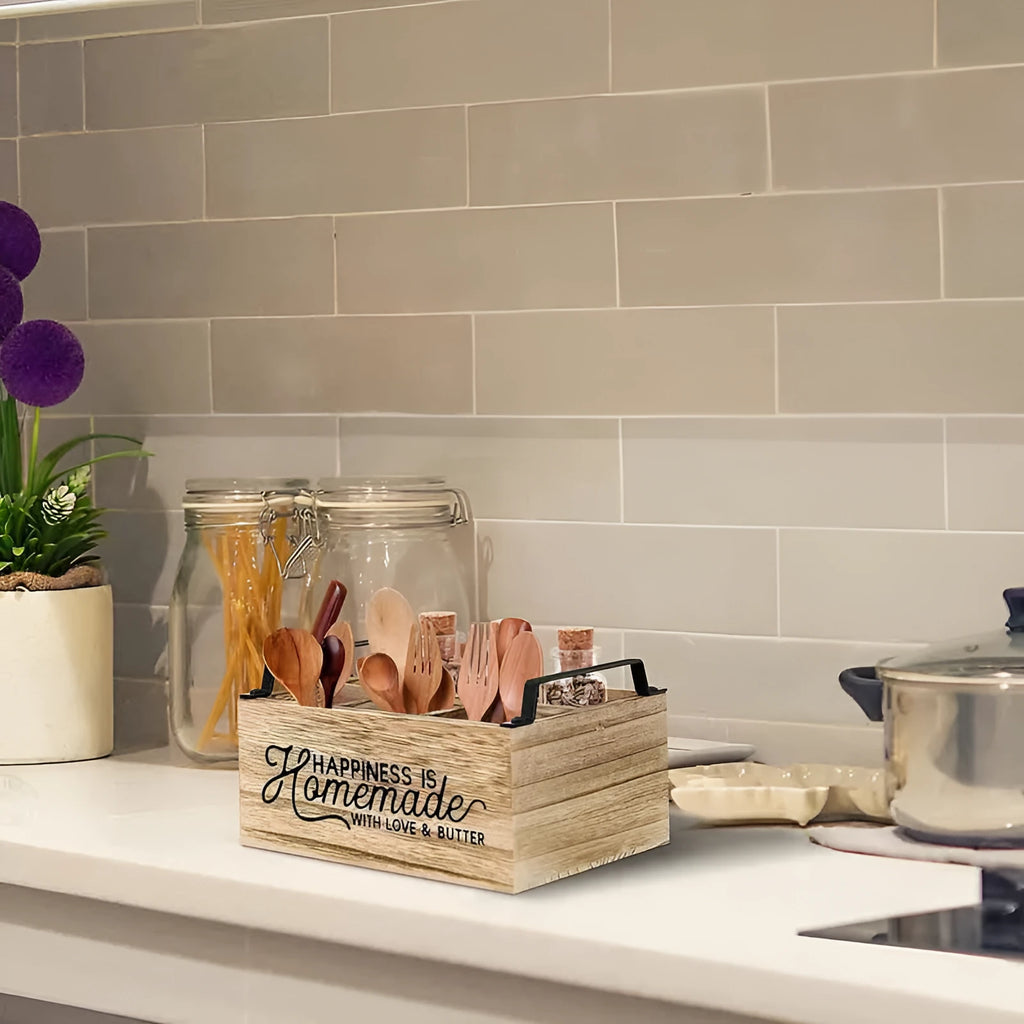 Wooden kitchen storage box with internal grid dividers for organising utensils.