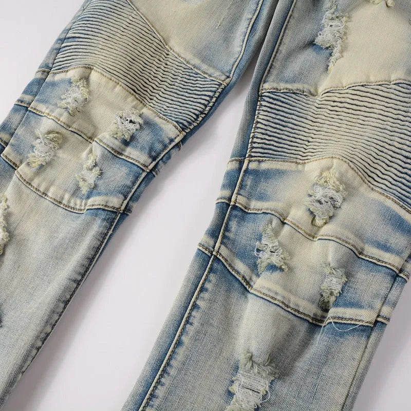 Light blue men's slim fit distressed jeans with hand-frayed details and an elastic waist.