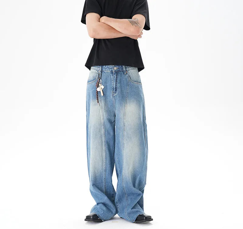 Cut washed vintage washed wide leg machete jeans in light blue denim fabric with zip fly