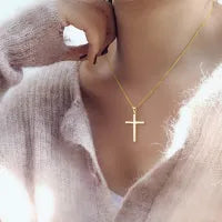 Sterling silver cross pendant necklace yellow gold plated 18 inch cable chain on white background