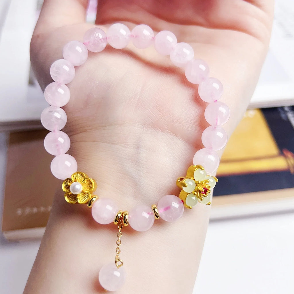 Pink Chinese crystal peach blossom bracelet with adjustable design on wrist