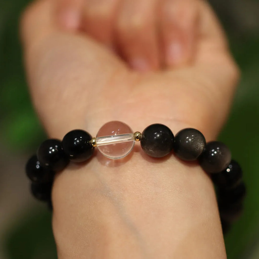 White and pink crystal bracelet with cat eye obsidian accents in Chinese geometric style