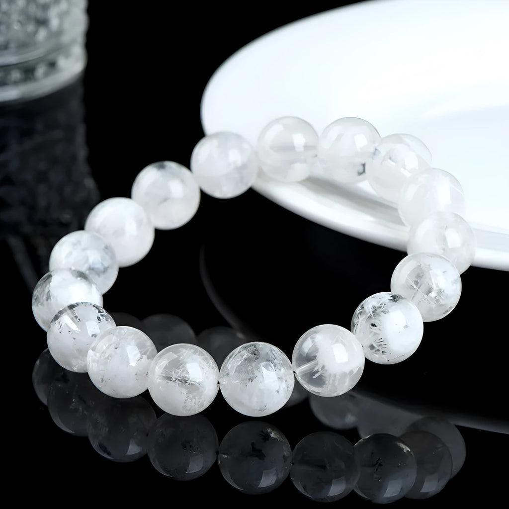 Original design women's crystal bracelet with natural blizzard snowflake round beads on a wrist.