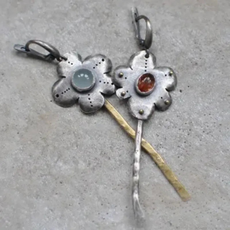 Long geometric flower earrings with two-tone asymmetrical colour on alloy metal.