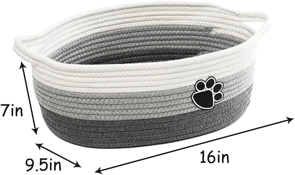 Small light beige woven cotton rope storage basket with wooden handles for organisation