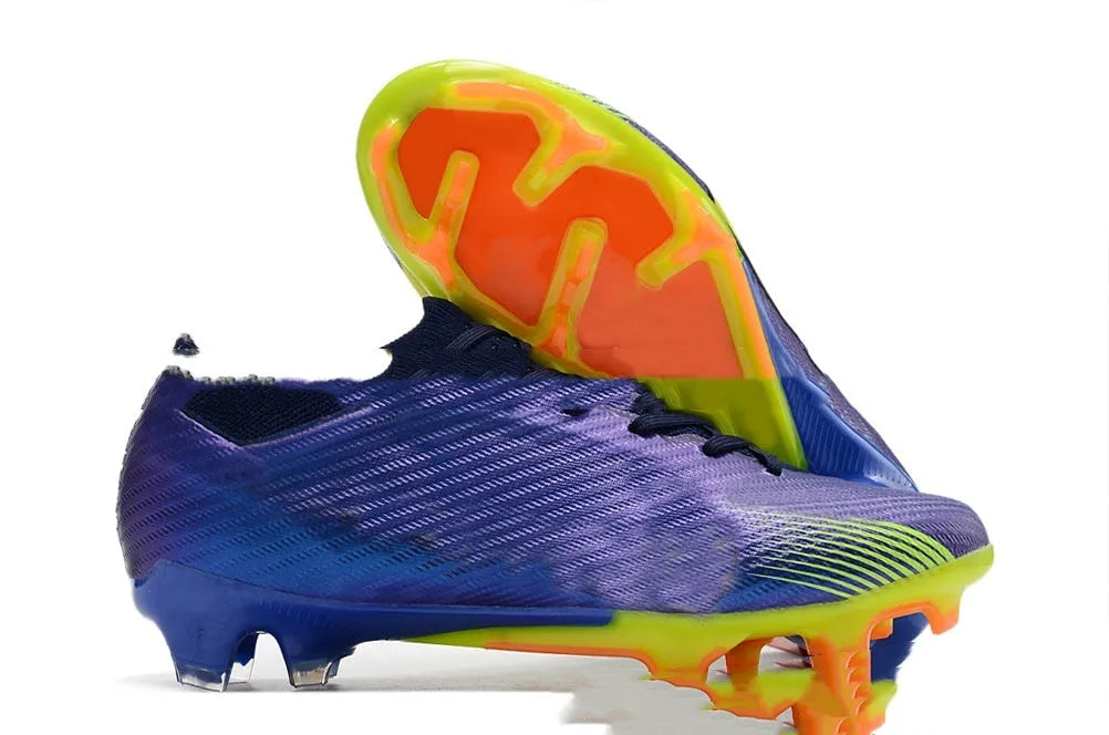 Men's low-top football shoes with knitted upper, rubber outsole with FG studs, shown in a front lace-up style.