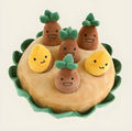 Yellow interactive dog puzzle pad with removable squeaky plush toys as a slow feeder and foraging game.