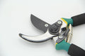 Yellow Teflon-coated 50# steel pruning shears with PVC elbow handle on white background