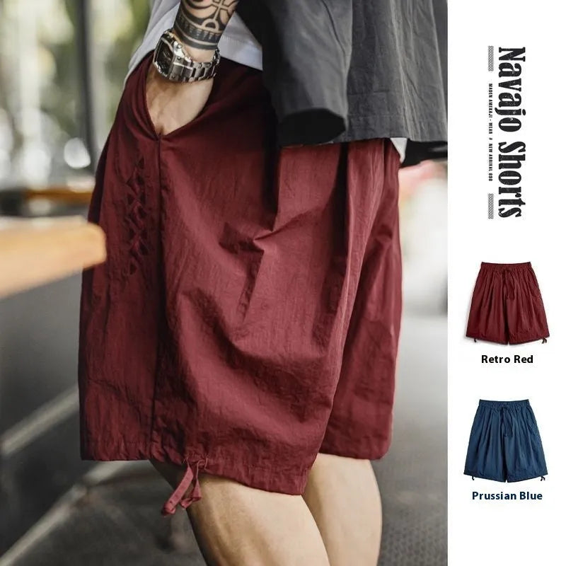 Men's embroidered beach shorts in Prussian Blue with loose fit design