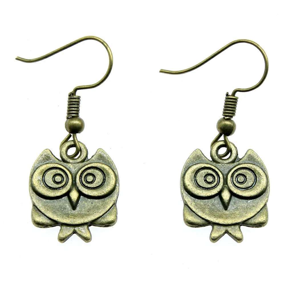 Retro double-sided owl earrings in antique bronze made of zinc alloy with iron ear hooks on a white background