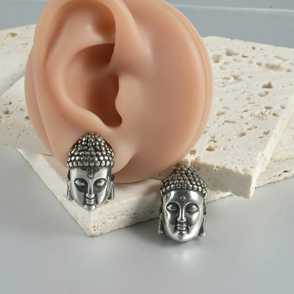 Stainless steel hollow skull and Buddha head geometric earrings in various electroplated colours.