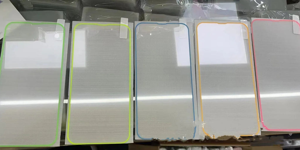 Fluorescent pink tempered glass screen protector fitted on an iPhone 13, showing full-screen coverage and luminous glow.