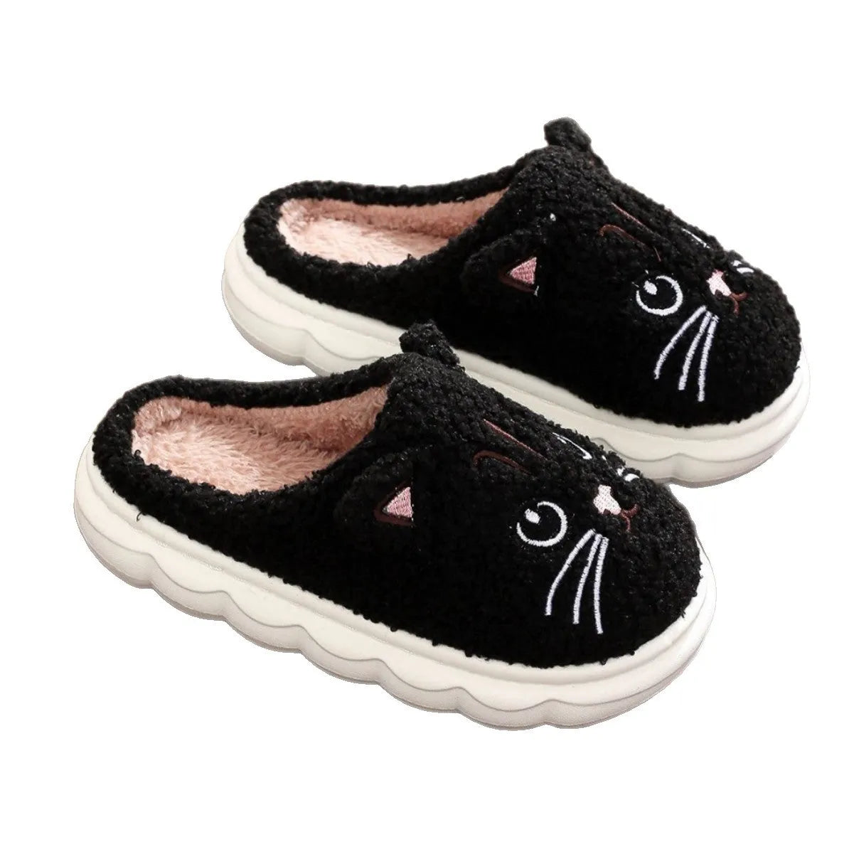 Pair of pink winter cartoon cat fluffy slippers on floor, non-slip EVA sole