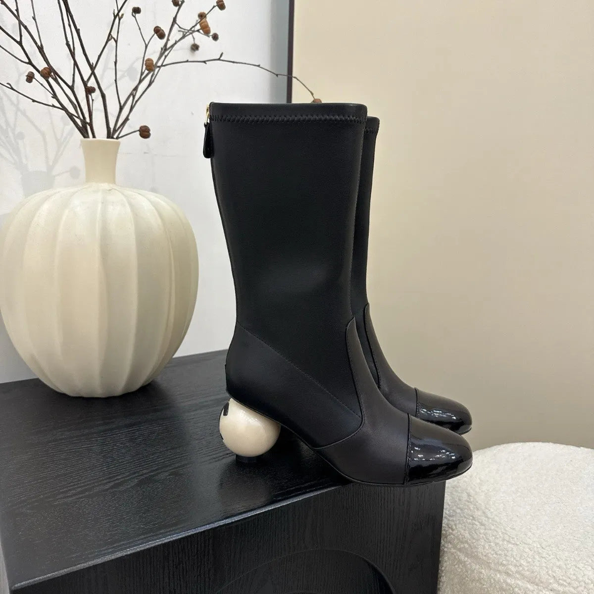 Women's chunky heel ankle boots with elastic fabric upper in black, white, and apricot side view