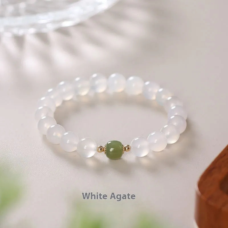 Handmade white agate bracelet with Hetian jade details and cinnabar inlays in 6mm and 8mm bead sizes