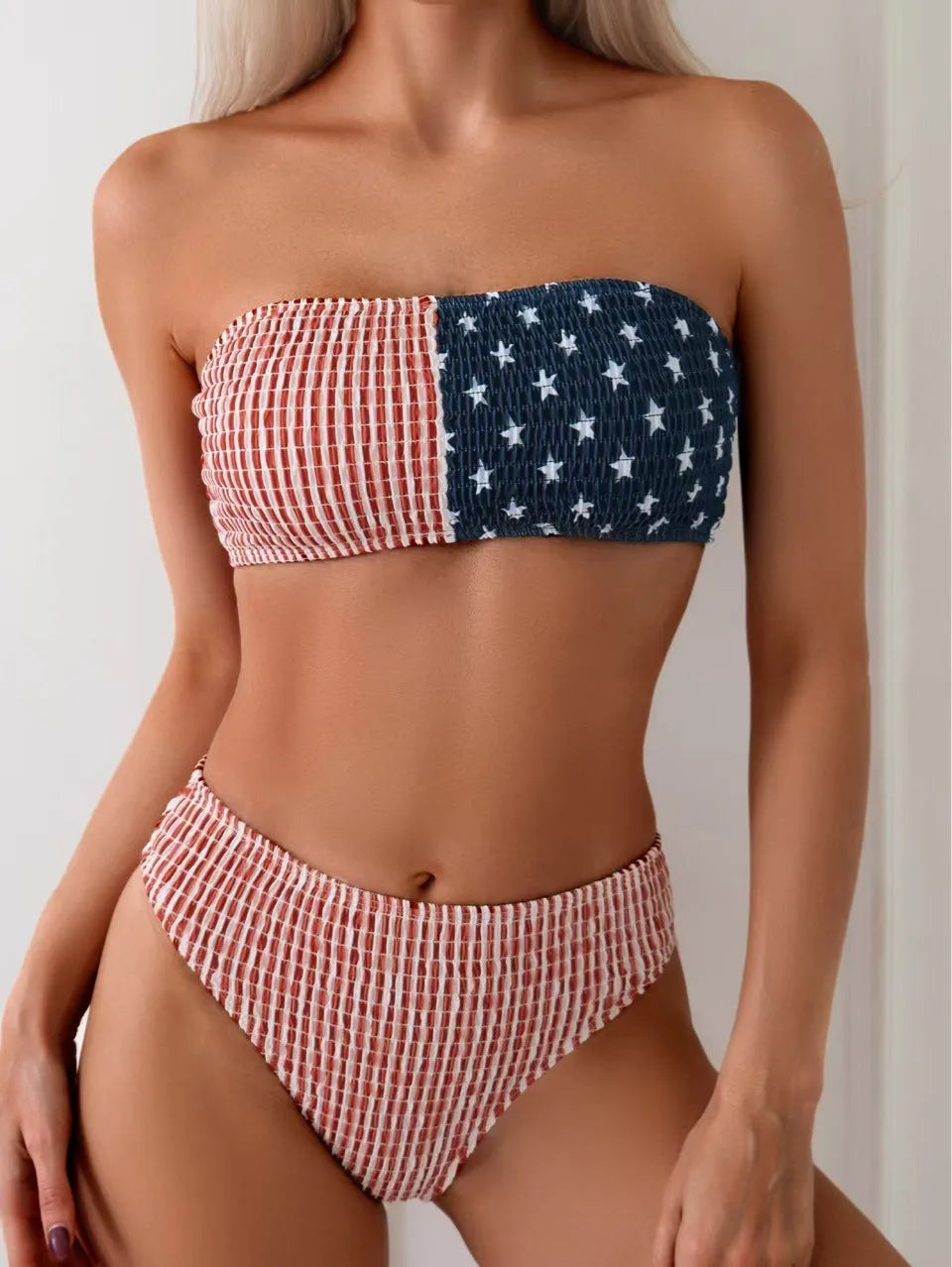 Women's red and blue high elasticity polyester bikini set on a beach background