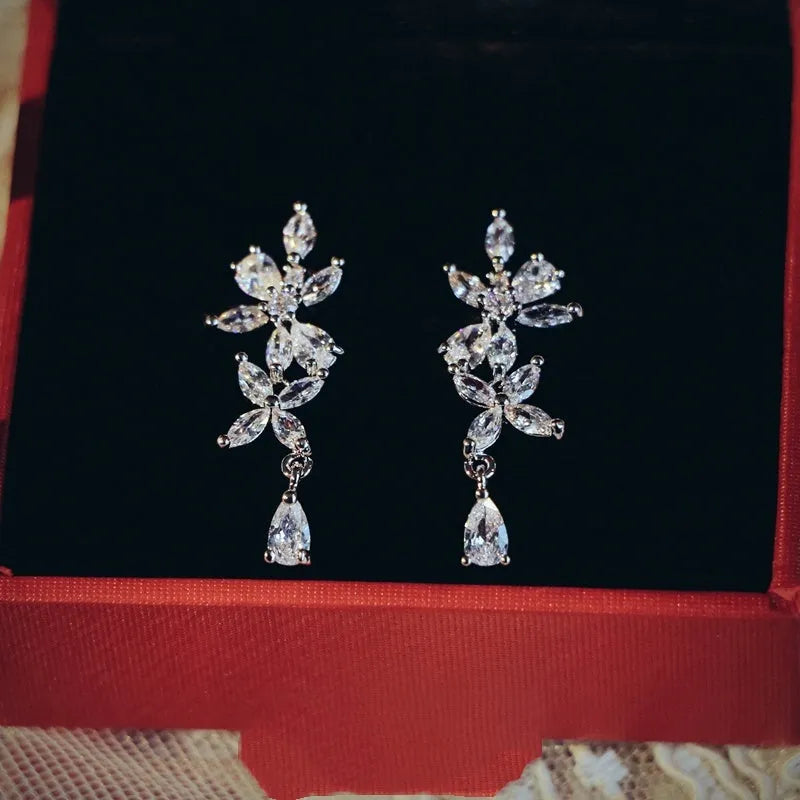 Silver alloy necklace and earrings set with zircon leaf design for bridal weddings