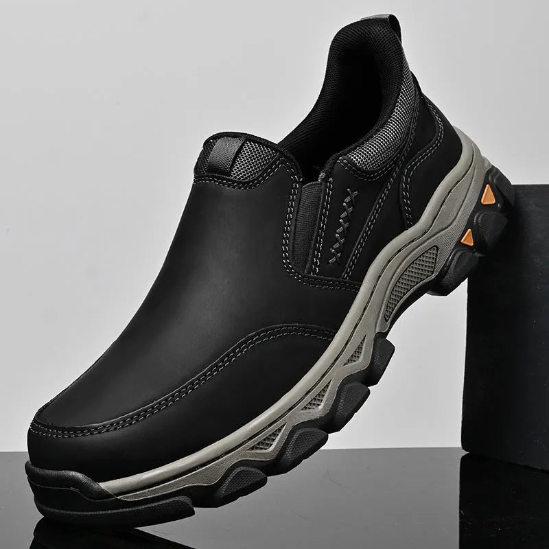 Men's dark brown casual leather shoes with round toe and flat rubber sole.
