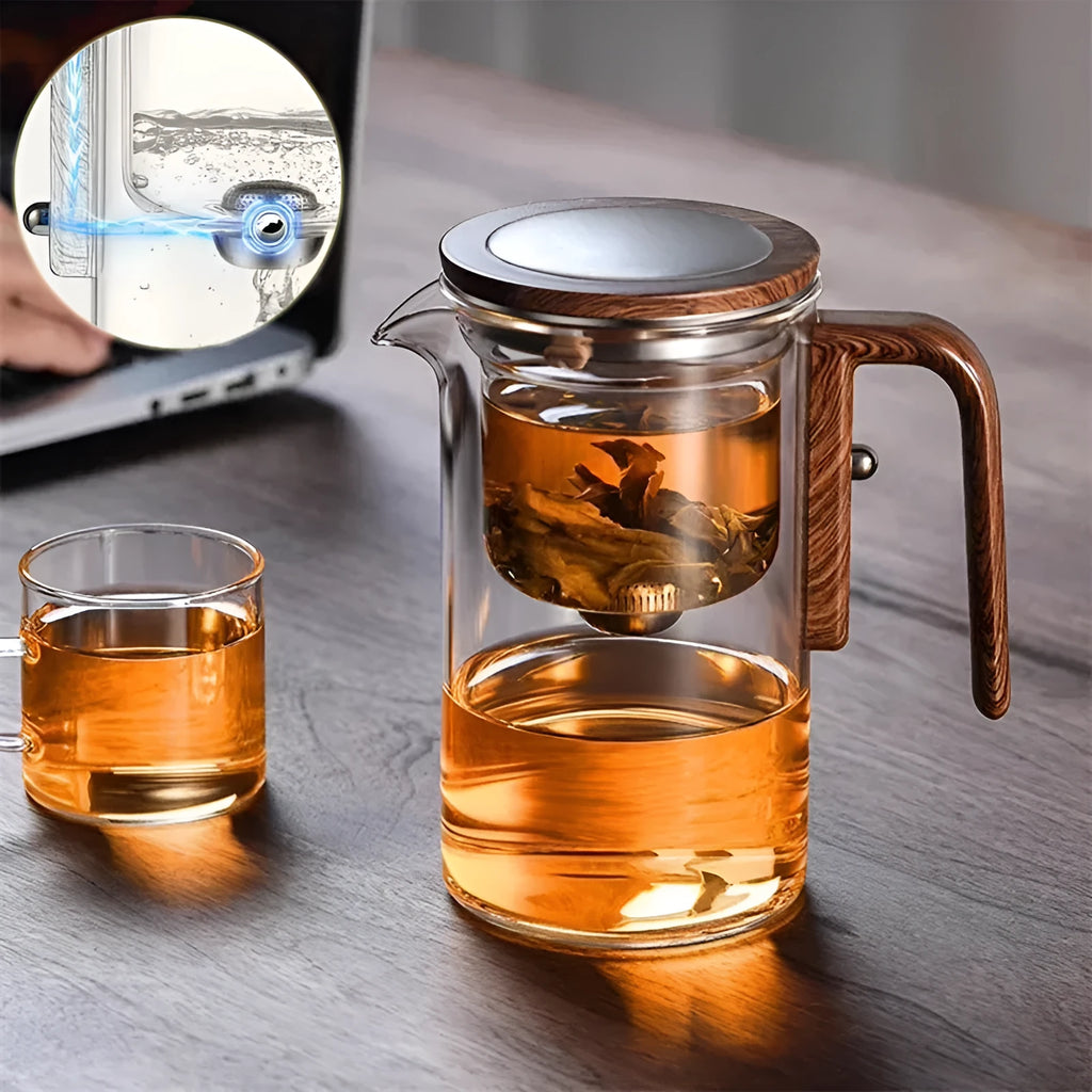 Glass teapot with wooden handle showing magnetic separation inner container and drip-free spout.