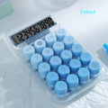 Round gradient colour mechanical keyboard calculator in mute blue, green, pink, or purple on a desk.