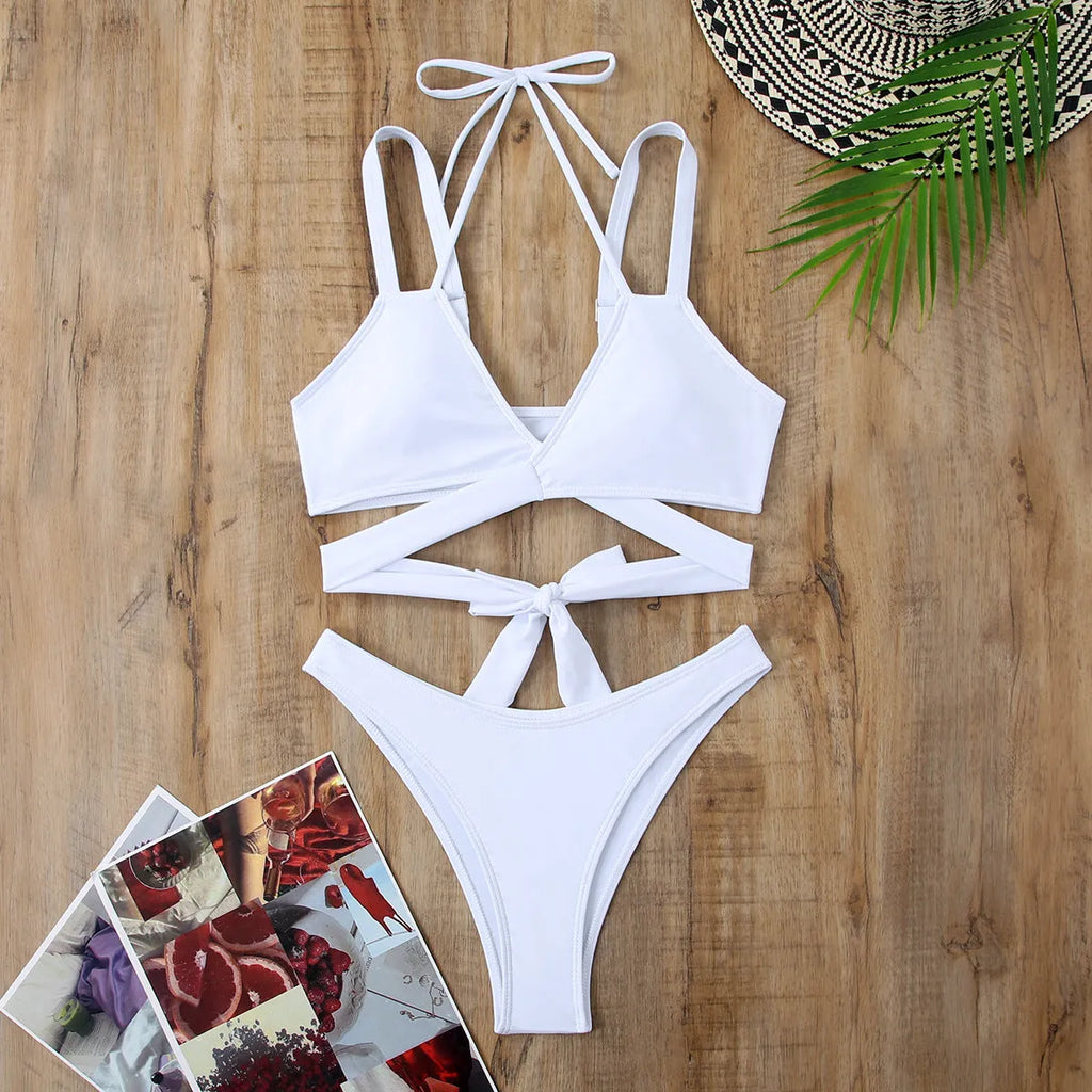 A solid colour women's bikini swimsuit with straps, shown in one of five available colours.