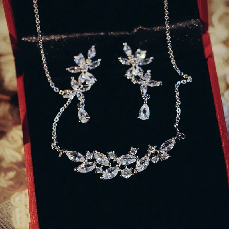 Silver alloy necklace and earrings set with zircon leaf design for bridal weddings