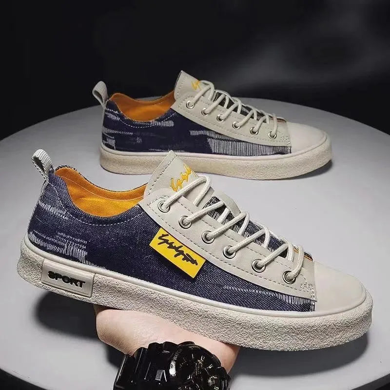 Men's dark blue round toe canvas shoes with white laces and a rubber sole.