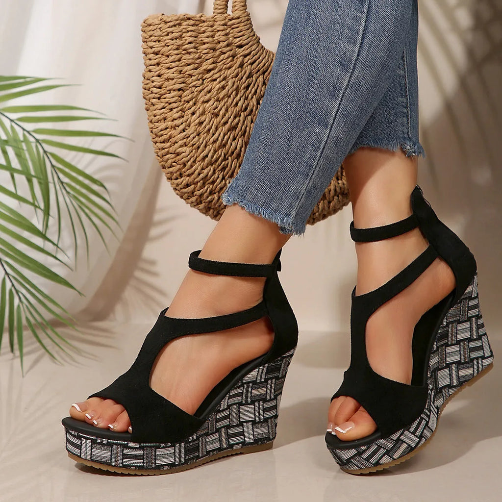 Women's cream white ankle-strap sandals with a buckle and thick rubber sole, shown from the side.
