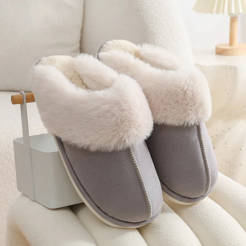Women's brown plush indoor slippers with a round toe, flat heel, and a textured PVC sole.