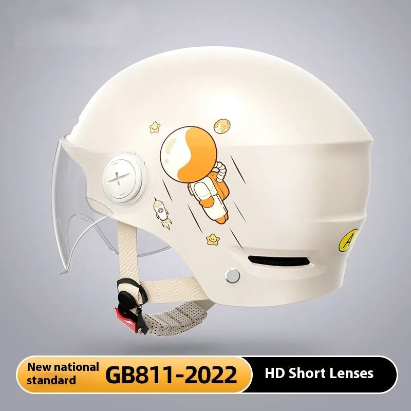 Khaki coloured open-face motorcycle helmet with a mirrored sun visor attached on a table.