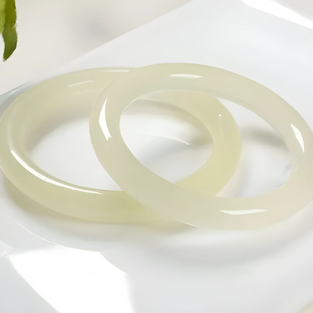 Round bar jade bracelet showing natural stone patterning with size measurement guide