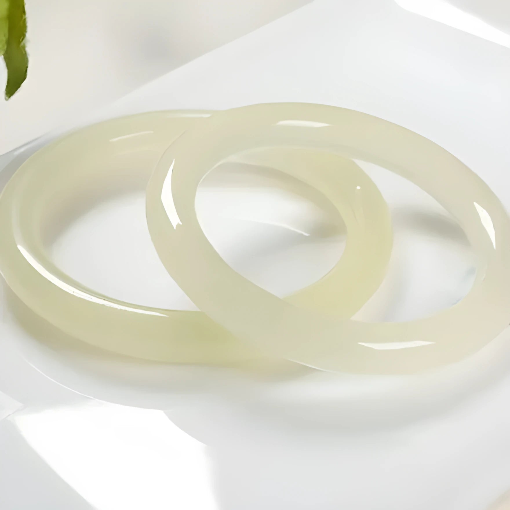 Round bar jade bracelet showing natural stone patterning with size measurement guide