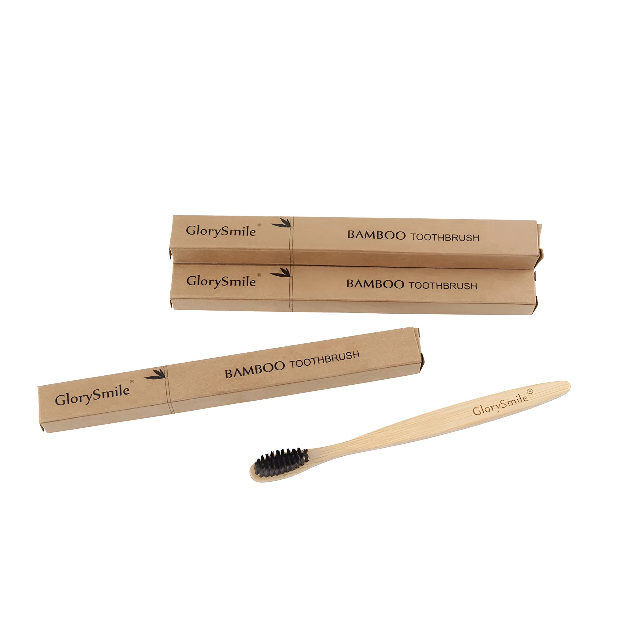 Natural bamboo toothbrush with black charcoal bristles on a white background