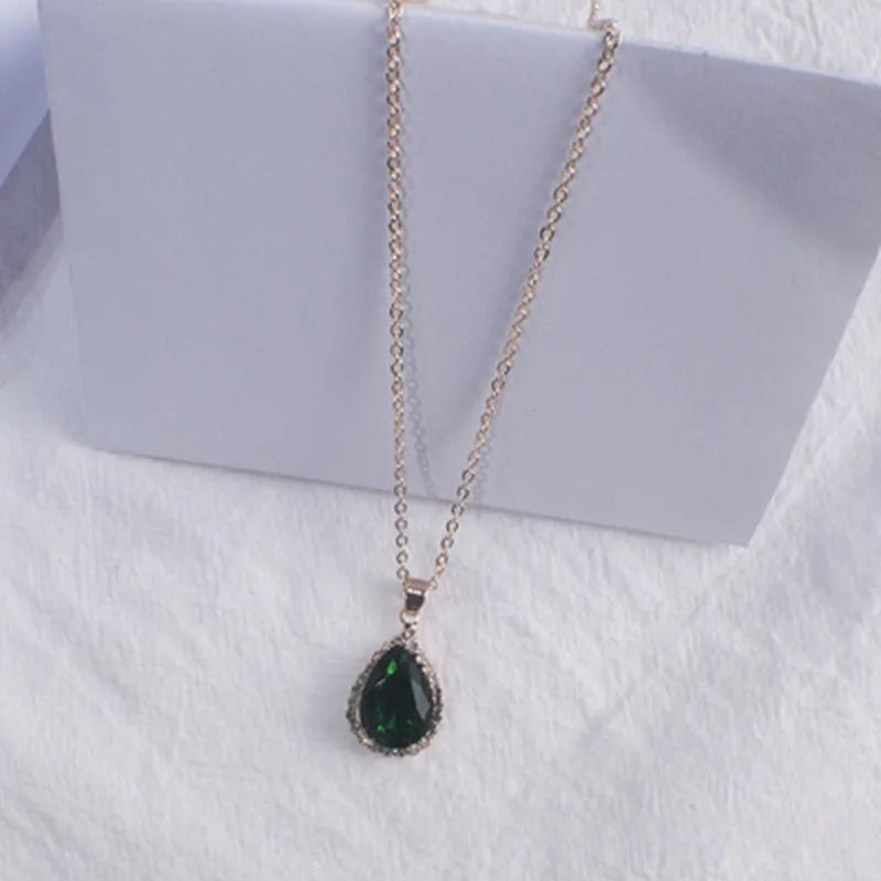 Women's water drop shaped pink necklace with rose gold rhinestone geometric detailing on alloy chain
