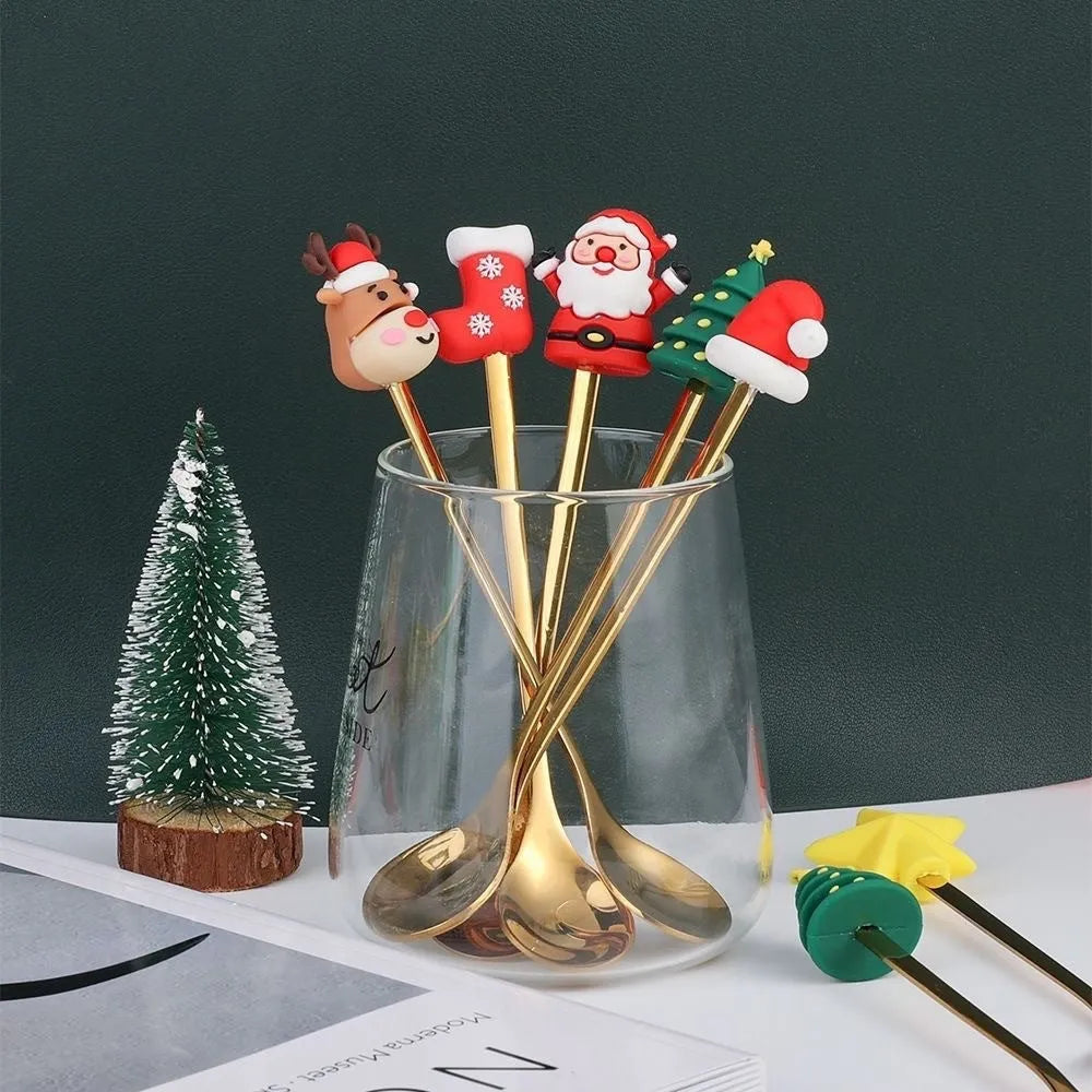 Stainless steel Christmas spoon and fork set with snowman and tree designs on handles