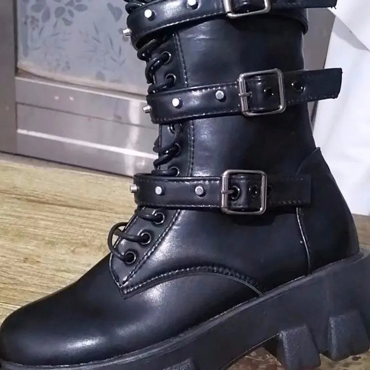 Black women's mid-calf boots with metal buckles and a side zip on a white background.