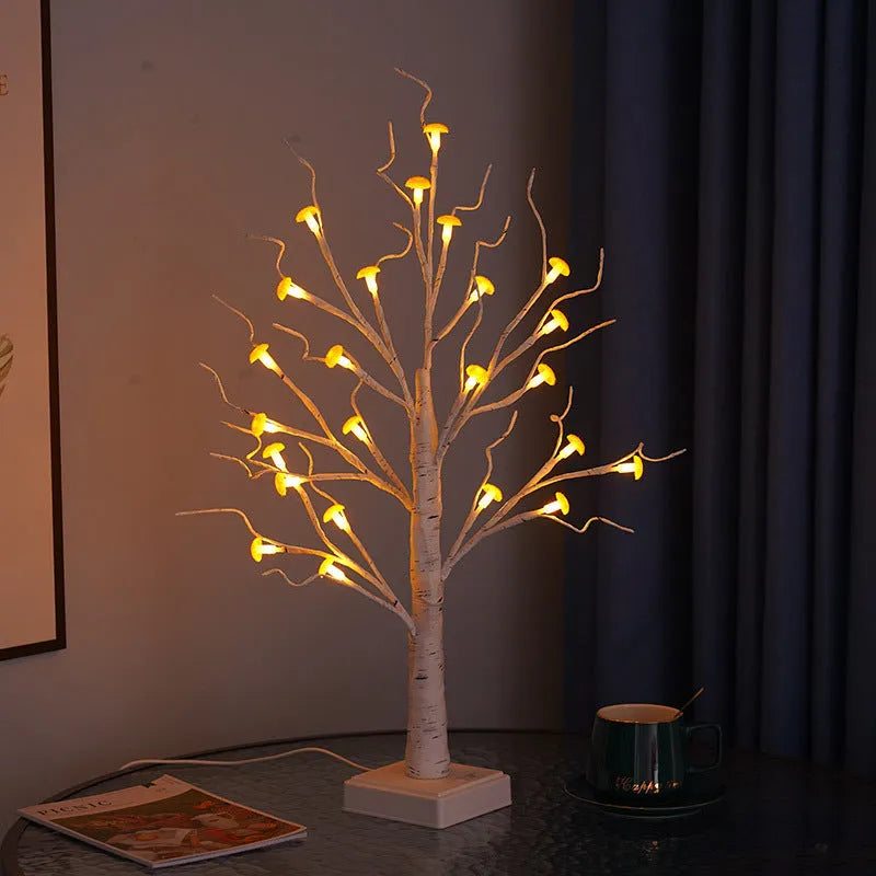 60cm tall white LED birch tree lamp with 24 small plastic mushroom-shaped warm white lights.