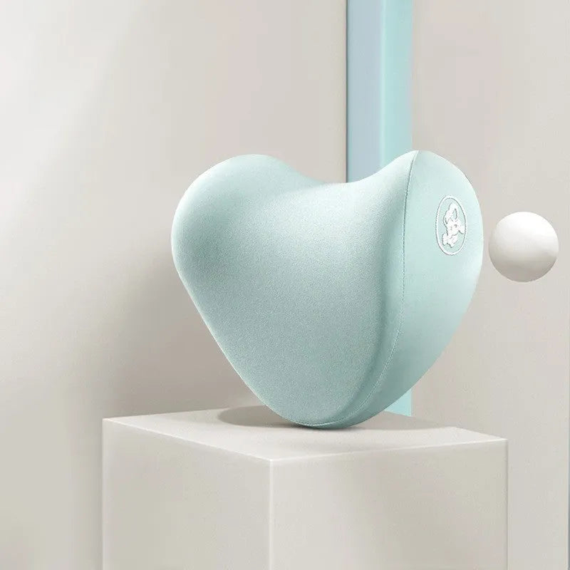 Heart-shaped car pillow in choice of colours, shown as headrest and lumbar support on a car seat.
