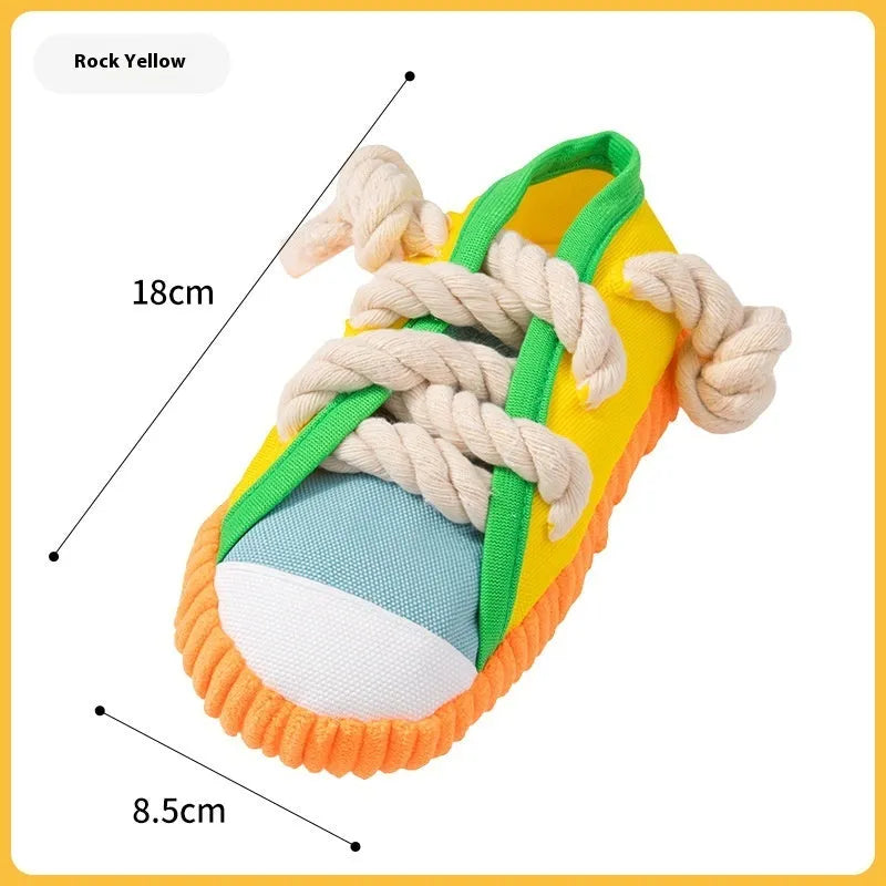 Squeaking plastic dog slipper chew toy in yellow, black, or blue colour.