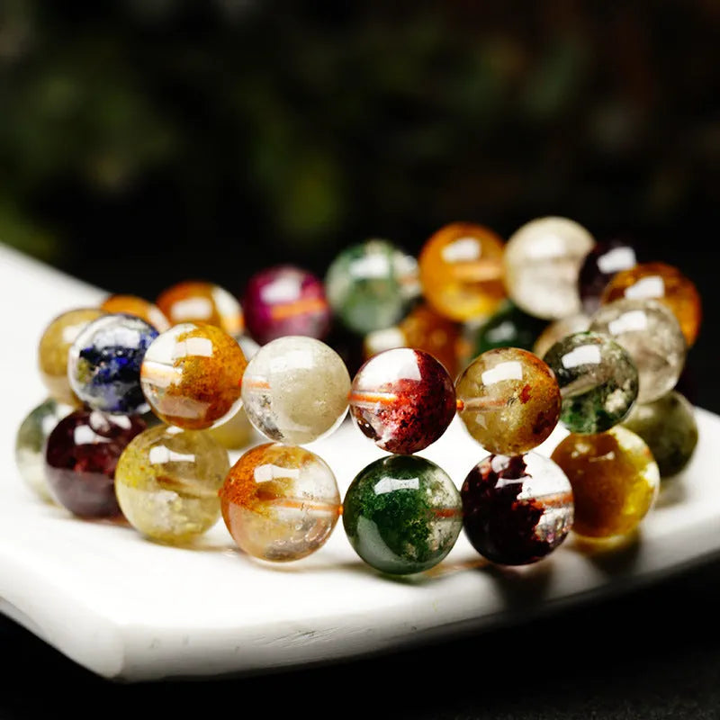 Crystal bracelet with 10mm beads showing a colourful natural four seasons ghost cornucopia ethnic design.
