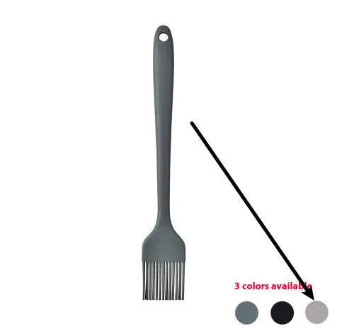 Silicone kitchen utensil set with twelve tools in a rotating white storage caddy on a counter.