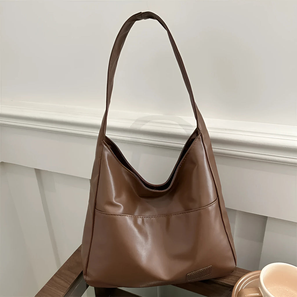 Women's retro large capacity PU bucket tote bag in Korean style with sewing thread detail, shown in coffee colour