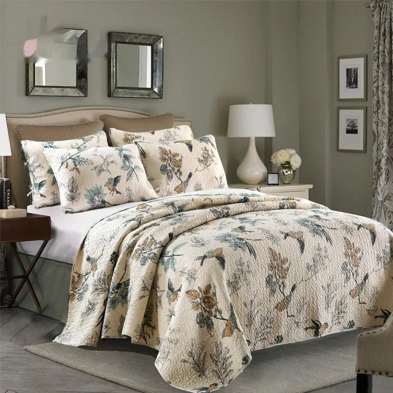 Quilted pure cotton bed cover with printed design, shown on a double bed with two matching pillowcases.