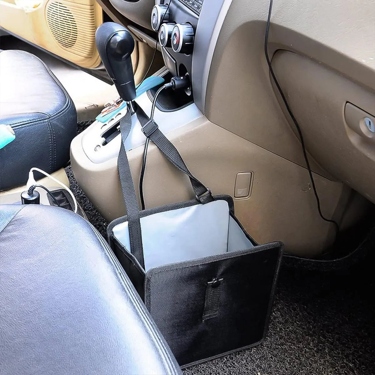 Black hanging car trash can made from Oxford cloth, showing its size and hanging loop.