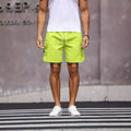 Men's loose fit workwear shorts in cool silk cotton fabric available in fluorescent green and army green colours