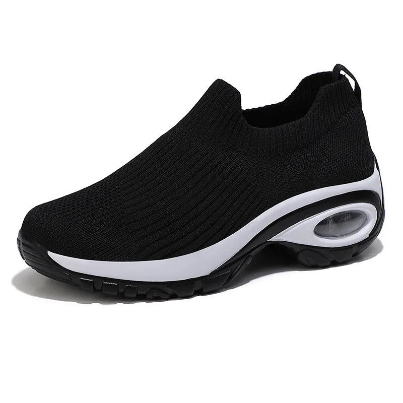 Women's air cushion running shoes in black, low top with fabric upper and wedge heel